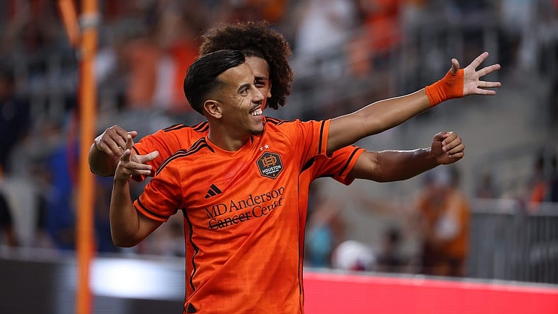 Aug 20, 2023; Houston, Texas, USA; Houston Dynamo midfielder Amine Bassi (8) celebrates after scoring a goal with teammate during the first half at Shell Energy Stadium. Mandatory Credit: Thomas Shea-USA TODAY Sports
