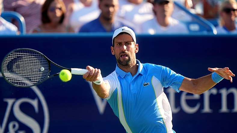 Novak Djokovic, of Serbia returns a shot to Carlos Alcaraz, of Spain, during the men   s singles final of the Western & Southern Open tennis tournament, Sunday, Aug. 20, 2023, at the Lindner Family Tennis Center in Mason, Ohio.