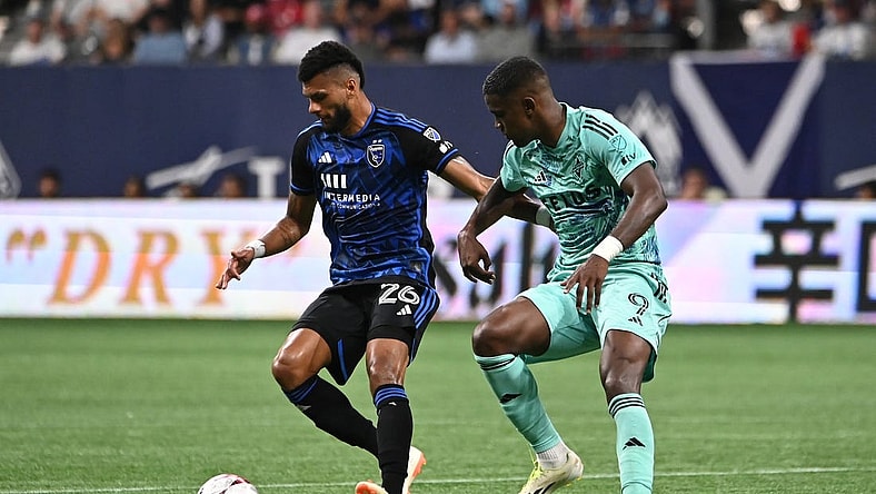 Aug 20, 2023; Vancouver, British Columbia, CAN; Vancouver Whitecaps FC forward Sergio Cordova (9) defends against San Jose Earthquakes defender Rodrigues (26) during first half at BC Place. Mandatory Credit: Simon Fearn-USA TODAY Sports