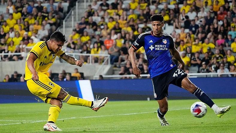 Aug 20, 2023; Columbus, Ohio, USA; Columbus Crew forward Cucho Hernandez (9) takes a shot past FC Cincinnati defender Ian Murphy (32) in the second half of the MLS soccer match at Lower.com Field.
