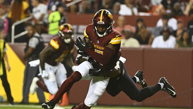 Aug 21, 2023; Landover, Maryland, USA; Washington Commanders wide receiver Terry McLaurin (17) runs after a catch during the first half at FedExField. Mandatory Credit: Brad Mills-USA TODAY Sports