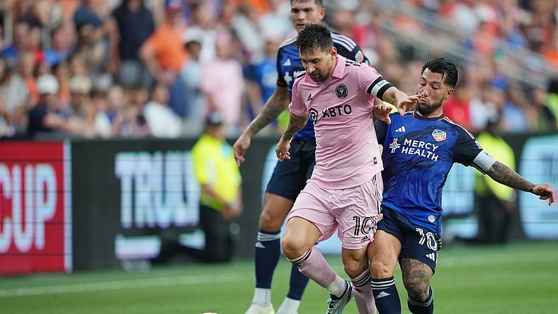 Aug 23, 2023; Cincinnati, OH, USA; Inter Miami forward Lionel Messi (10) plays the ball defended by FC Cincinnati midfielder Luciano Acosta (10) in the first half at TQL Stadium. Mandatory Credit: Aaron Doster-USA TODAY Sports