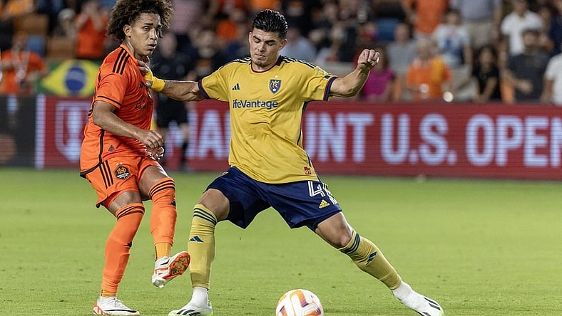 Aug 23, 2023; Houston, TX, USA; Houston Dynamo midfielder Adalberto Carrasquilla (20) passes against Real Salt Lake defender Brayan Vera (4) in the second half at Shell Energy Stadium. Mandatory Credit: Thomas Shea-USA TODAY Sports