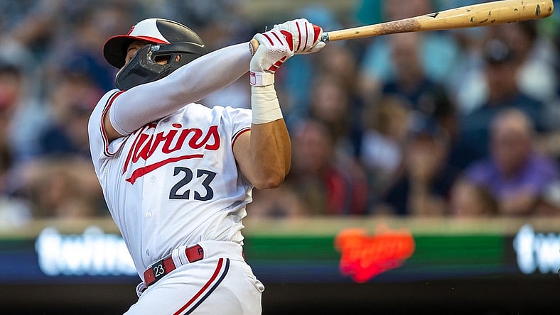 Aug 24, 2023; Minneapolis, Minnesota, USA; Minnesota Twins third baseman Royce Lewis (23) hits a double in the fourth inning against the Texas Rangers in the fourth inning at Target Field. Mandatory Credit: Jesse Johnson-USA TODAY Sports