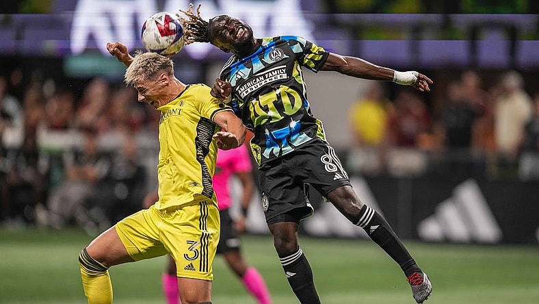 Aug 26, 2023; Atlanta, Georgia, USA; Nashville SC defender Lukas MacNaughton (3) and Atlanta United midfielder Tristan Muyumba (8) battle for the ball during the first half at Mercedes-Benz Stadium. Mandatory Credit: Dale Zanine-USA TODAY Sports