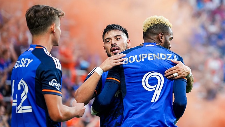 Aug 26, 2023; Cincinnati, Ohio, USA;  FC Cincinnati forward Aaron Boupendza (9) celebrates with midfielder Junior Moreno (93) after scoring a goal against New York City FC in the first half at TQL Stadium. Mandatory Credit: Aaron Doster-USA TODAY Sports