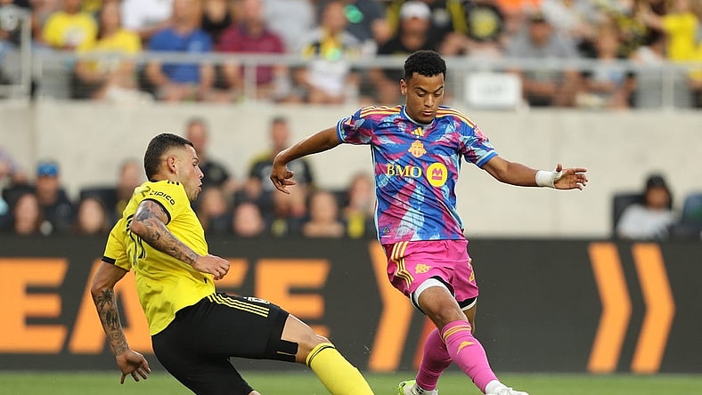 Aug 26, 2023; Columbus, Ohio, USA; Toronto FC midfielder Brandon Servania (23) in action against Columbus Crew SC forward Christian Ramirez (17) during the first half at Lower.com Field. Mandatory Credit: Joseph Maiorana-USA TODAY Sports