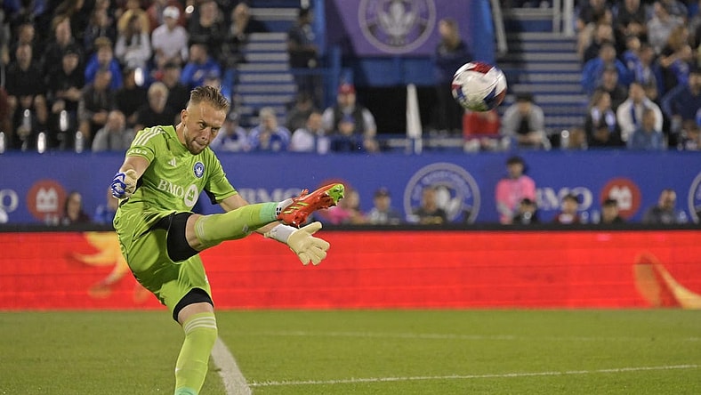 Aug 26, 2023; Montreal, Quebec, CAN; CF Montreal goalkeeper Jonathan Sirois (40) punts the ball against the New England Revolution during the second half at Stade Saputo. Mandatory Credit: Eric Bolte-USA TODAY Sports