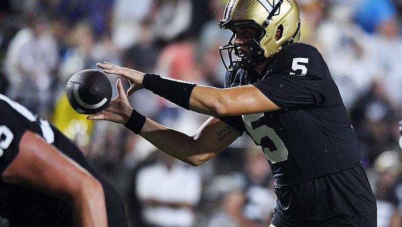 Aug 26, 2023; Nashville, Tennessee, USA; Vanderbilt Commodores quarterback AJ Swann (5) takes the snap during the first half against the Hawaii Warriors at FirstBank Stadium. Mandatory Credit: Christopher Hanewinckel-USA TODAY Sports