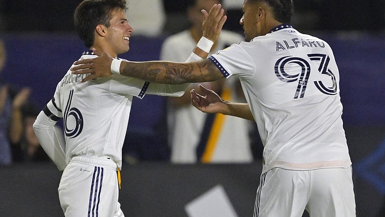 Aug 26, 2023; Carson, California, USA; Los Angeles Galaxy midfielder Riqui Puig (6) is congratulated by defender Tony Alfaro (93) after he scored a goal in the second half against the Chicago Fire at Dignity Health Sports Park. Mandatory Credit: Jayne Kamin-Oncea-USA TODAY Sports