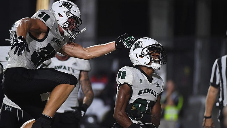 Aug 26, 2023; Nashville, Tennessee, USA; Hawaii Warriors wide receiver Pofele Ashlock (86) celebrates with running back Landon Sims (30) after a touchdown during the second half against the Vanderbilt Commodores at FirstBank Stadium. Mandatory Credit: Christopher Hanewinckel-USA TODAY Sports