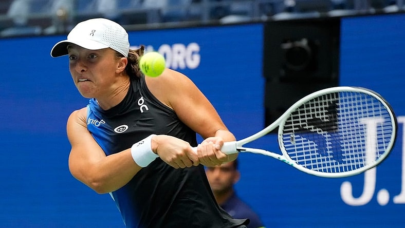 Aug 28, 2023; Flushing, NY, USA; Iga Swiatek of Poland hits to Rebecca Peterson of Sweden on day one of the 2023 U.S. Open tennis tournament at USTA Billie Jean King National Tennis Center. Mandatory Credit: Robert Deutsch-USA TODAY Sports