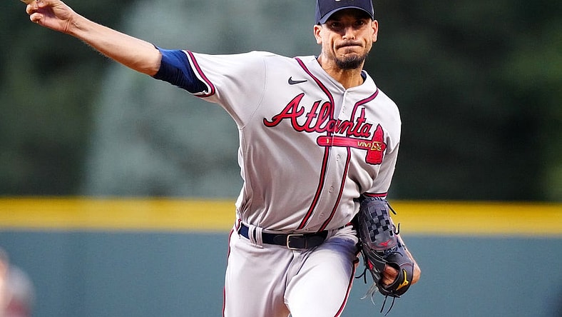 Aug 29, 2023; Denver, Colorado, USA; Atlanta Braves starting pitcher Charlie Morton (50) delivers a pitch in the first inning against the Colorado Rockies at Coors Field. Mandatory Credit: Ron Chenoy-USA TODAY Sports