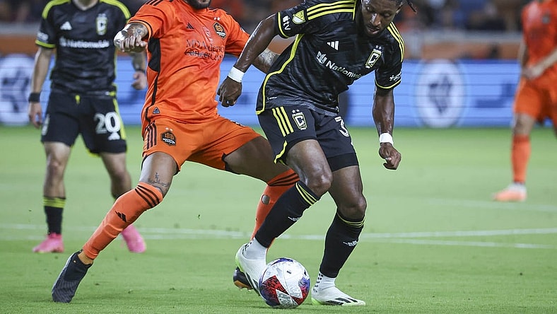 Aug 30, 2023; Houston, Texas, USA; Houston Dynamo FC midfielder Artur (6) and Columbus Crew SC defender Steven Moreira (31) battle for the ball during the first half at Shell Energy Stadium. Mandatory Credit: Troy Taormina-USA TODAY Sports