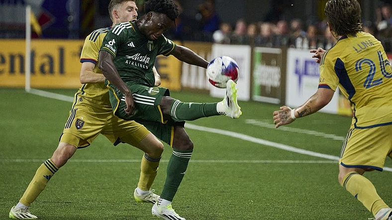 Aug 30, 2023; Portland, Oregon, USA; Portland Timbers midfielder Santiago Moreno (30) kicks the ball during the first half against Real Salt Lake defender Andrew Brody (2) at Providence Park. Mandatory Credit: Troy Wayrynen-USA TODAY Sports