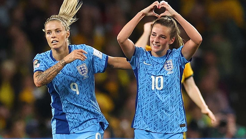 England's Ella Toone celebrates scoring their first goal with Rachel Daly.