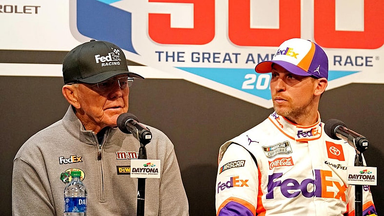 Feb 17, 2020; Daytona Beach, Florida, USA; NASCAR Cup Series driver Denny Hamlin (11) speaks to media with team owner Joe Gibbs (left) after the Daytona 500 at Daytona International Speedway. Mandatory Credit: John David Mercer-USA TODAY Sports