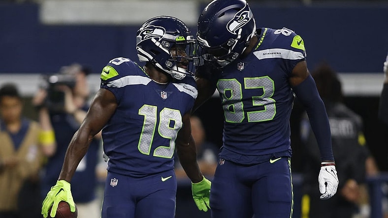 Aug 26, 2022; Arlington, Texas, USA; Seattle Seahawks wide receiver Penny Hart (19) and wide receiver Dareke Young (83) celebrate a touchdown in first quarter against the Dallas Cowboys at AT&T Stadium. Mandatory Credit: Tim Heitman-USA TODAY Sports