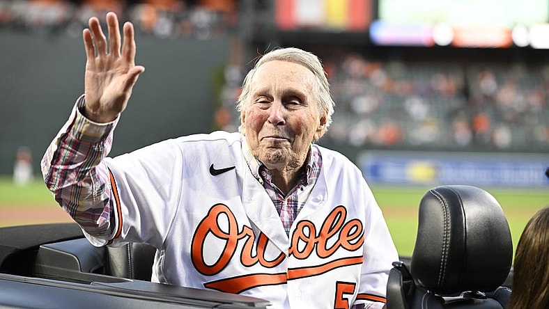 Sep 24, 2022; Baltimore, Maryland, USA; Hall of Fame member and former Baltimore Orioles player Brooks Robinson waves to the crowd prior to a game between the Orioles and the Houston Astros at Oriole Park at Camden Yards. Mandatory Credit: James A. Pittman-USA TODAY Sports