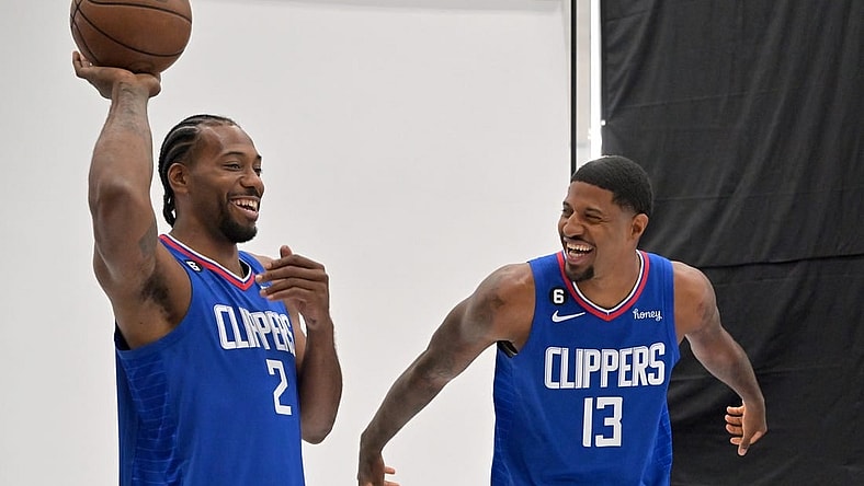 Sep 26, 2022; Playa Vista, CA, USA;  Los Angeles Clippers forward Kawhi Leonard (2) and Los Angeles Clippers guard Paul George (13) are photographed on media day at The Honey Training Center in Playa Vista, CA. Mandatory Credit: Jayne Kamin-Oncea-USA TODAY Sports