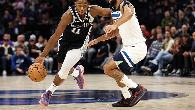 Oct 24, 2022; Minneapolis, Minnesota, USA; San Antonio Spurs guard Joshua Primo (11) dribbles while Minnesota Timberwolves guard Jordan McLaughlin (6) defends during the first quarter at Target Center. Mandatory Credit: Matt Krohn-USA TODAY Sports