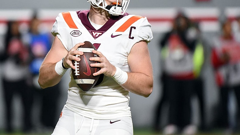 Oct 27, 2022; Raleigh, North Carolina, USA; Virginia Tech Hokies quarterback Grant Wells (6) drops back to pass during the first half against the North Carolina State Wolfpack at Carter-Finley Stadium. Mandatory Credit: Rob Kinnan-USA TODAY Sports