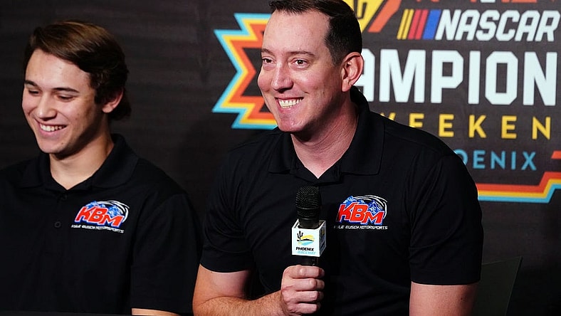 Nov 4, 2022; Avondale, Arizona, USA; Kyle Busch alongside Chase Purdy addresses the media about Kyle Busch Motorsports 2023 NASCAR Craftsman Truck Series lineup and drivers during a press conference at Phoenix Raceway. Mandatory Credit: John David Mercer-USA TODAY Sports