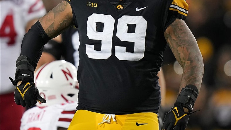 Iowa defensive lineman Noah Shannon (99) reacts after tackling Nebraska running back Anthony Grant for a loss of yards in the fourth quarter during a NCAA football game on Friday, Nov. 25, 2022, at Kinnick Stadium in Iowa City.

Iowavsneb 20221125 Bh