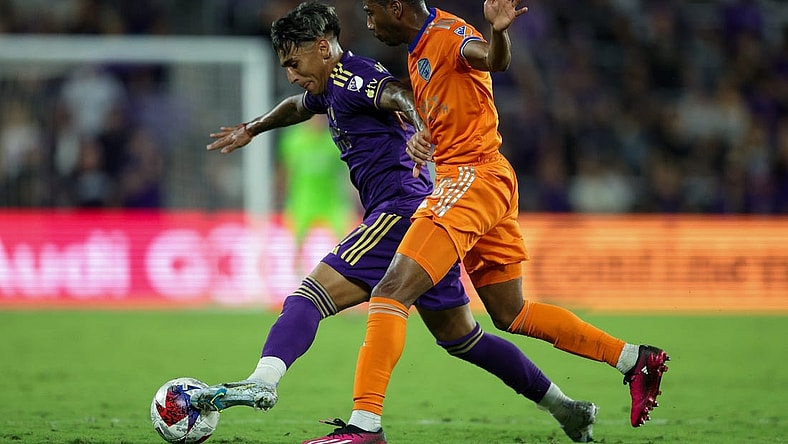 Mar 4, 2023; Orlando, Florida, USA;  Orlando City SC forward Facundo Torres (17) controls the ball from FC Cincinnati defender Ray Gaddis (28) in the second half at Exploria Stadium. Mandatory Credit: Nathan Ray Seebeck-USA TODAY Sports