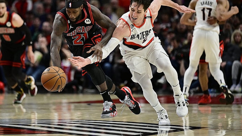 Mar 24, 2023; Portland, Oregon, USA; Chicago Bulls guard Patrick Beverley (21) steals the basketball away from Portland Trail Blazers guard Ryan Arcidiacono (51) during the first half at Moda Center. Mandatory Credit: Troy Wayrynen-USA TODAY Sports