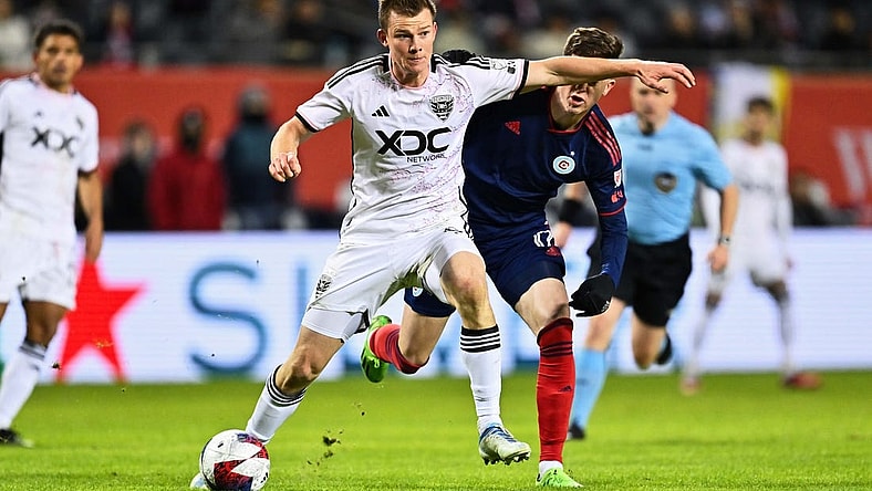 Apr 1, 2023; Chicago, Illinois, USA;  DC United midfielder Chris Durkin (8) controls the ball against the Chicago Fire FC at Soldier Field. Mandatory Credit: Jamie Sabau-USA TODAY Sports