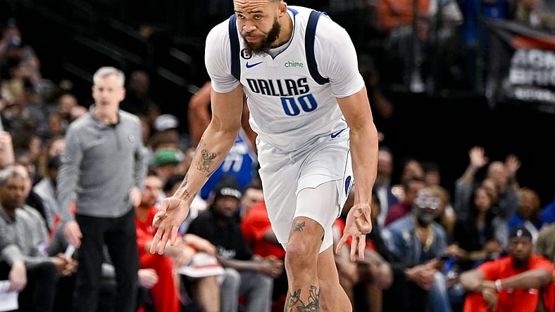 Apr 7, 2023; Dallas, Texas, USA; Dallas Mavericks center JaVale McGee (00) celebrates after making a three point shot against the Chicago Bulls during the first half at the American Airlines Center. Mandatory Credit: Jerome Miron-USA TODAY Sports