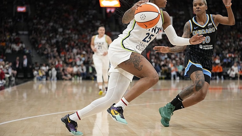 May 13, 2023; Toronto, Ontario, Canada; Minnesota Lynx guard Tiffany Mitchell (25) drives to the net against Chicago Sky guard Courtney Williams (10) during the second half at Scotiabank Arena. Mandatory Credit: John E. Sokolowski-USA TODAY Sports
