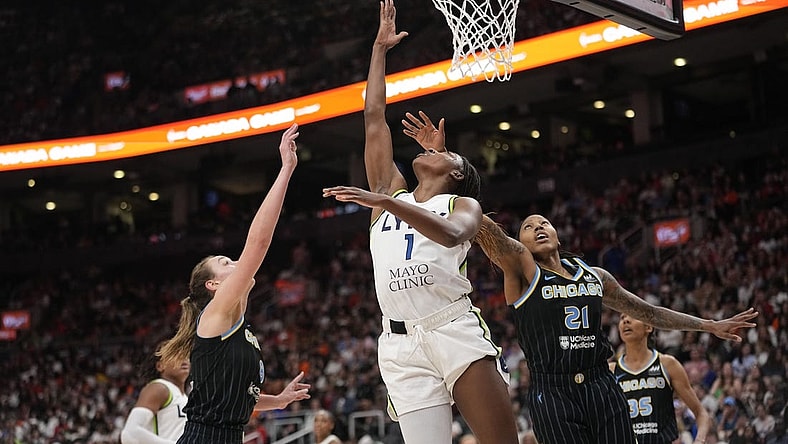 May 13, 2023; Toronto, Ontario, Canada; Minnesota Lynx forward Diamond Miller (1) goes to make a basket against Chicago Sky forward Robyn Parks (21) and forward Alanna Smith (8) during the second half at Scotiabank Arena. Mandatory Credit: John E. Sokolowski-USA TODAY Sports