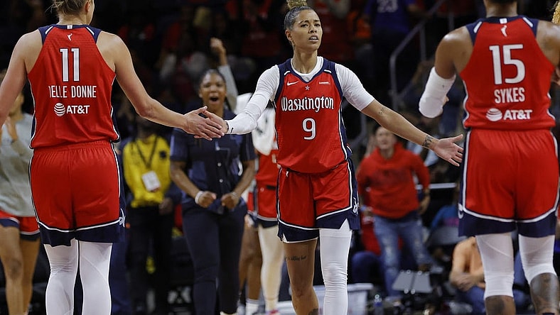 May 19, 2023; Washington, District of Columbia, USA; Washington Mystics guard Natasha Cloud (9) celebrates with Mystics forward Elena Delle Donne (11) and Mystics guard Brittney Sykes (15) in the fourth quarter at Entertainment & Sports Arena. Mandatory Credit: Geoff Burke-USA TODAY Sports