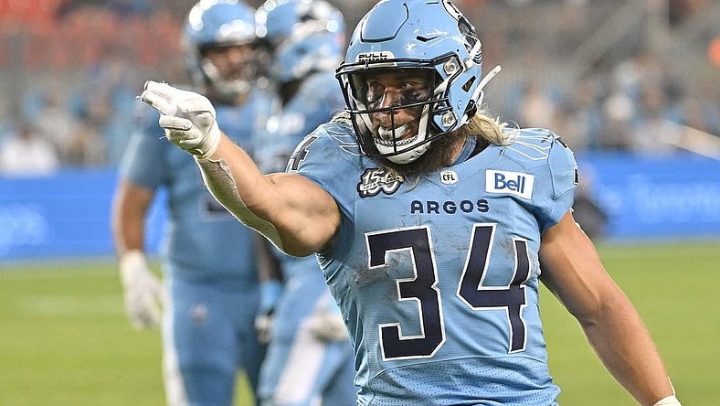 Jun 18, 2023; Toronto, Ontario, CAN;  Toronto Argonauts running back AJ Ouellette (34) gestures after running for a first down against the Hamilton Tiger-Cats in the fourth quarter at BMO Field. Mandatory Credit: Dan Hamilton-USA TODAY Sports