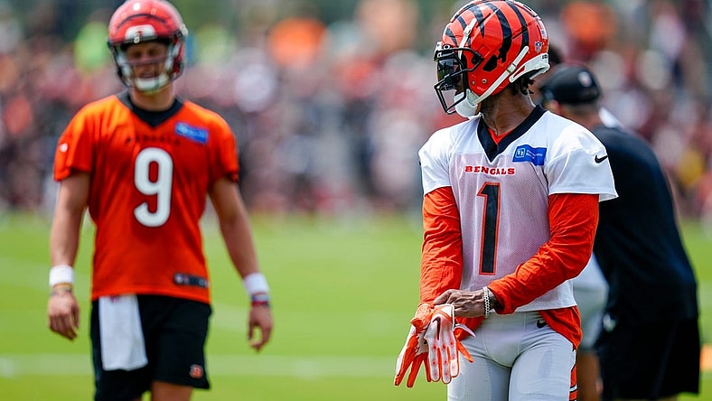Cincinnati Bengals wide receiver Ja'Marr Chase (1) and Cincinnati Bengals quarterback Joe Burrow (9) line up before a play during a training camp practice at the Paycor Stadium practice field in downtown Cincinnati on Wednesday, July 26, 2023.