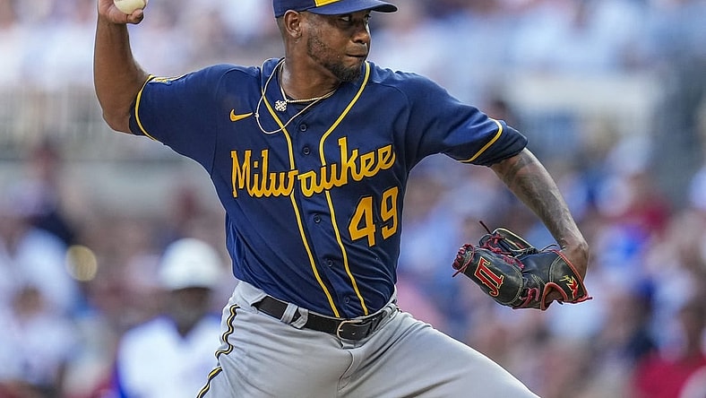 Jul 29, 2023; Cumberland, Georgia, USA; Milwaukee Brewers starting pitcher Julio Teheran (49) pitches against the Atlanta Braves during the first inning at Truist Park. Mandatory Credit: Dale Zanine-USA TODAY Sports