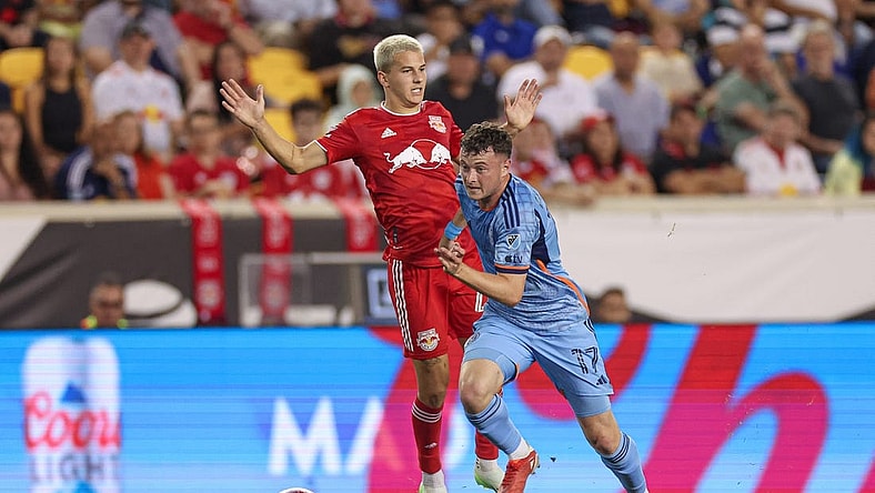 Aug 3, 2023; Harrison, NJ, USA; New York City FC midfielder Matias Pellegrini (17) plays the ball against New York Red Bulls defender Andres Reyes (4) during the second half at Red Bull Arena. Mandatory Credit: Vincent Carchietta-USA TODAY Sports