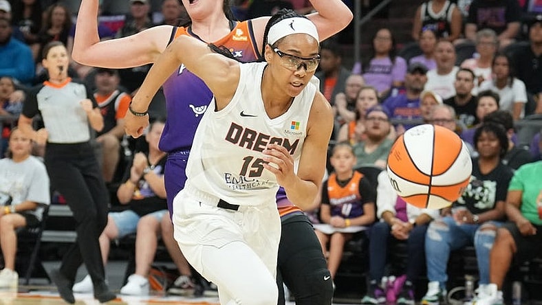 Aug 3, 2023; Phoenix, Arizona, USA; Atlanta Dream guard Allisha Gray (15) chases the ball against Phoenix Mercury center Megan Gustafson (10) during the game at at Footprint Center. Mandatory Credit: Joe Camporeale-USA TODAY Sports