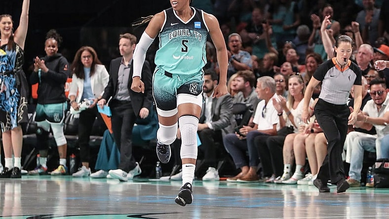 Aug 6, 2023; Brooklyn, New York, USA;  New York Liberty forward Kayla Thornton (5) celebrates after making a three point shot in the third quarter against the Las Vegas Aces at Barclays Center. Mandatory Credit: Wendell Cruz-USA TODAY Sports