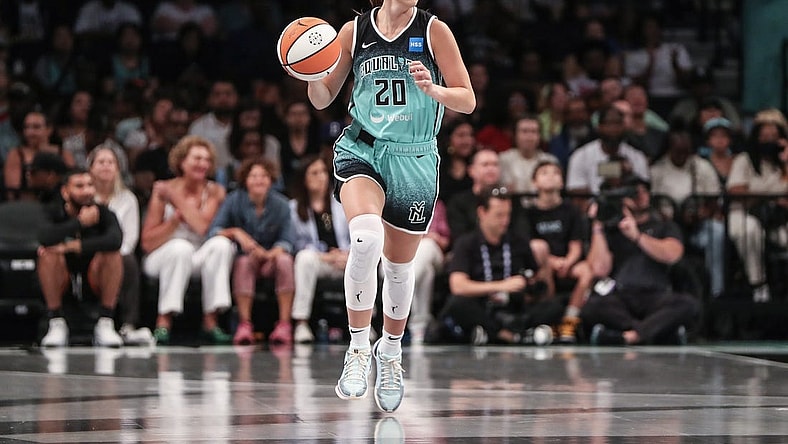 Aug 6, 2023; Brooklyn, New York, USA; New York Liberty guard Sabrina Ionescu (20) brings the ball up in the first quarter against the Las Vegas Aces at Barclays Center. Mandatory Credit: Wendell Cruz-USA TODAY Sports