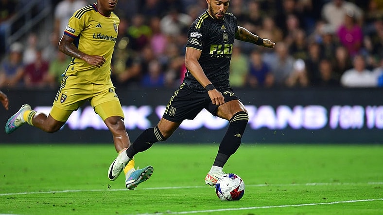 Aug 8, 2023; Los Angeles, CA, USA; Los Angeles FC forward Denis Bouanga (99) scores a goal against Real Salt Lake during the second half at BMO Stadium. Mandatory Credit: Gary A. Vasquez-USA TODAY Sports