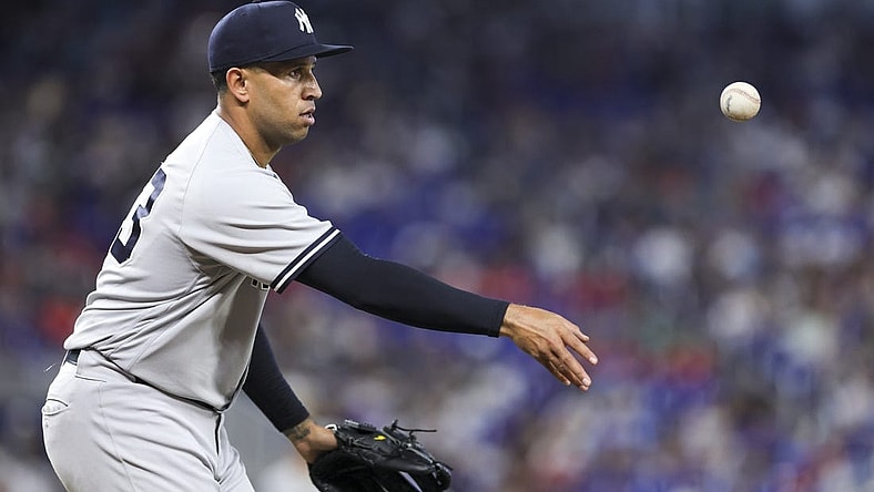 Aug 13, 2023; Miami, Florida, USA; New York Yankees relief pitcher Keynan Middleton (93) tosses the baseball to first base and retires Miami Marlins right fielder Jesus Sanchez (not pictured) during the eighth inning at loanDepot Park. Mandatory Credit: Sam Navarro-USA TODAY Sports