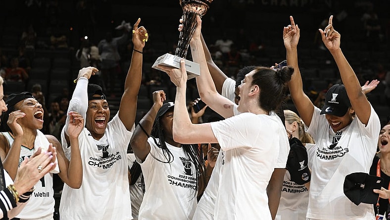 Aug 15, 2023; Las Vegas, Nevada, USA; New York Liberty forward Breanna Stewart holds the Commissioner's Cup trophy while celebrating with teammates after defeating the Las Vegas Aces to win the Commissioner   s Cup Championship at Michelob Ultra Arena. Mandatory Credit: Candice Ward-USA TODAY Sports
