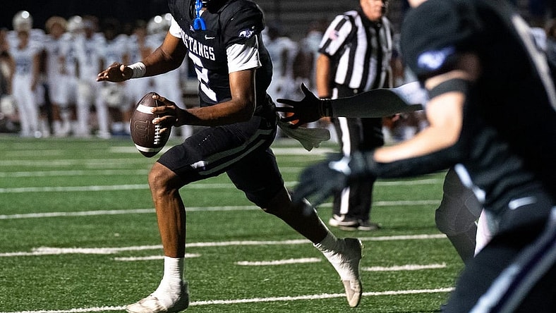 Lipscomb's Deuce Knight (2) looks upfield against IMG at Lipscomb's Reese Smith Football Field in Nashville, Tenn., Friday night, Aug. 18, 2023. IMG went on to win the game 35-10.