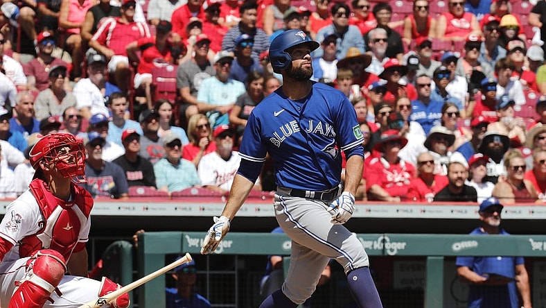 Aug 20, 2023; Cincinnati, Ohio, USA; Toronto Blue Jays designated hitter Brandon Belt (13) hits a two-run home run against the Cincinnati Reds during the second inning at Great American Ball Park. Mandatory Credit: David Kohl-USA TODAY Sports