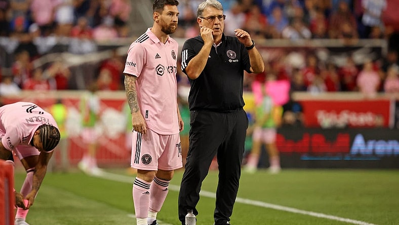 Aug 26, 2023; Harrison, New Jersey, USA; Inter Miami CF forward Lionel Messi (10) talks with head coach Gerardo Martino before being put into the game New York Red Bulls during the second half at Red Bull Arena. Mandatory Credit: Vincent Carchietta-USA TODAY Sports