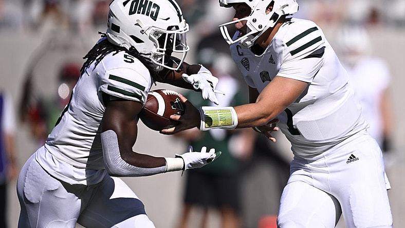 Aug 26, 2023; San Diego, California, USA; Ohio Bobcats quarterback Kurtis Rourke (7) hands off to running back Sieh Bangura (5) during the first half against the San Diego State Aztecs at Snapdragon Stadium. Mandatory Credit: Orlando Ramirez-USA TODAY Sports