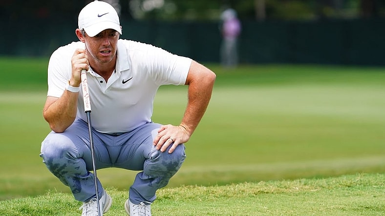 Aug 27, 2023; Atlanta, Georgia, USA; Rory McIlroy lines up his putt on the first green during the final round of the TOUR Championship golf tournament at East Lake Golf Club. Mandatory Credit: John David Mercer-USA TODAY Sports